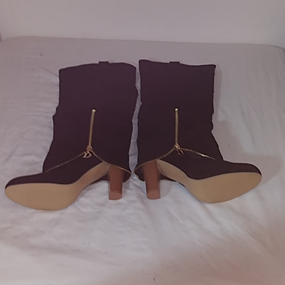 Black side zipper knee high 4" stacked heel boots.
